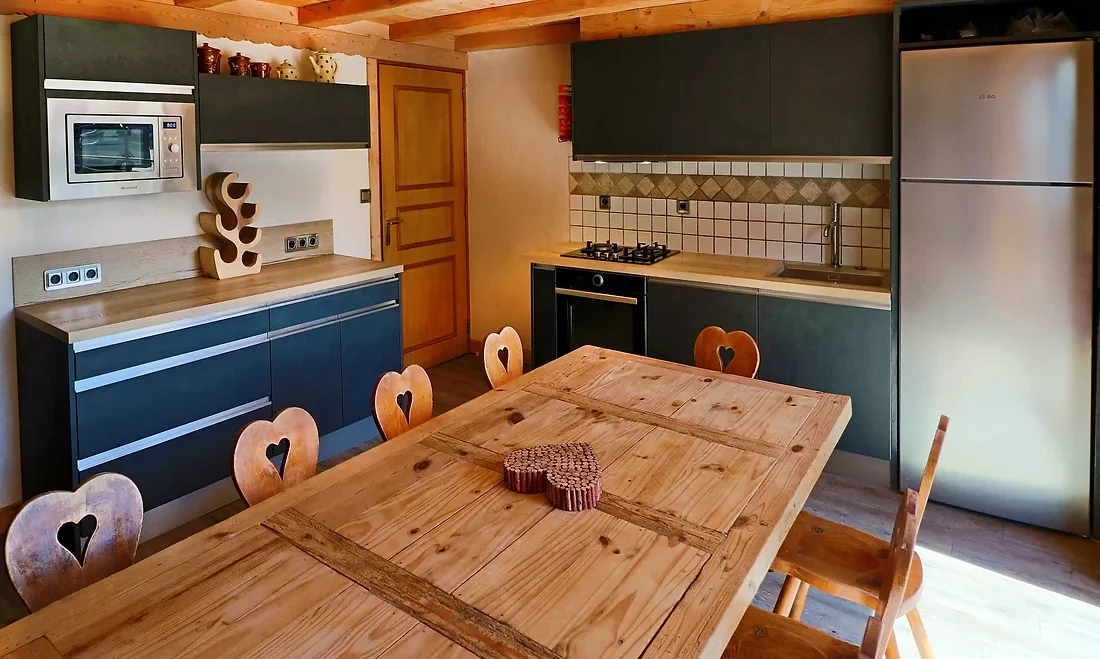 The Kitchen and dining area in Chalet La Combe in Meribel