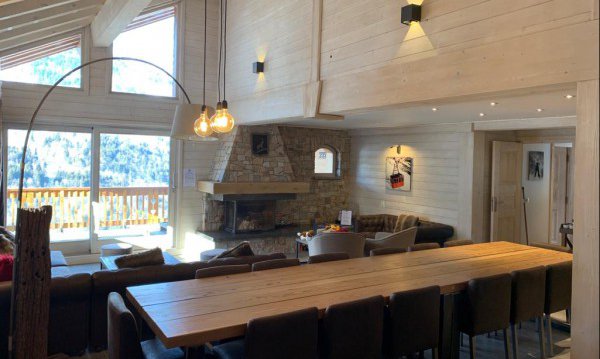 Dining area and living room in Chalet Chardon in Meribel