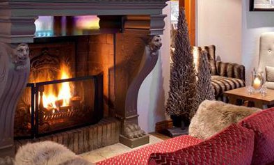 Roaring Fire and Comfortable Sofas