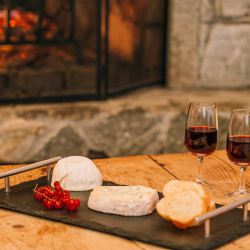 Cheese and wine beside the fire