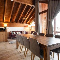 The Dining and Living area with Stove in Chalet Mathilde Val Thorens