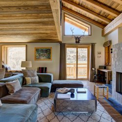 The Living room with fireplace in Chalet Bergeronnette Meribel Nantgerel