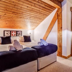 One of the comfortable bedrooms in Chalet Cecilia Meribel