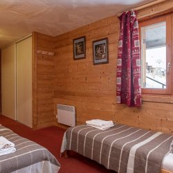 A twin bedroom in Chalet Natalette 1 Meribel Mottaret
