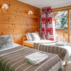 A twin bedroom in Chalet Natalette 1 in Meribel Mottaret