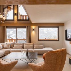The Living area with fireplace in Chalet Evergreen Meribel