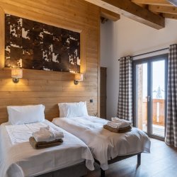 One of the Twin Bedrooms in Ski in/Ski out Chalet Evergreen in Meribel