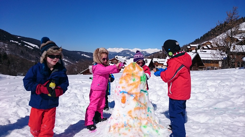 Children making a snowman