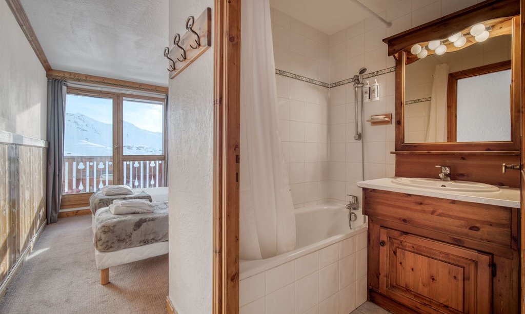 An ensuite bedroom in Catered Chalet Bonhomme Val Thorens