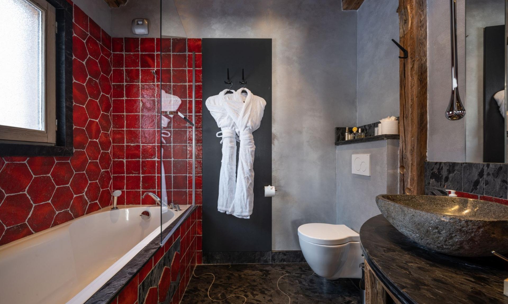 One of the bathrooms in Catered Chalet Cheval Blanc Meribel Le Raffort