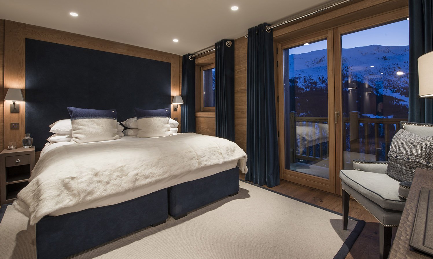 A spacious and comfortable bedroom in Chalet Le Grenier in Meribel Centre