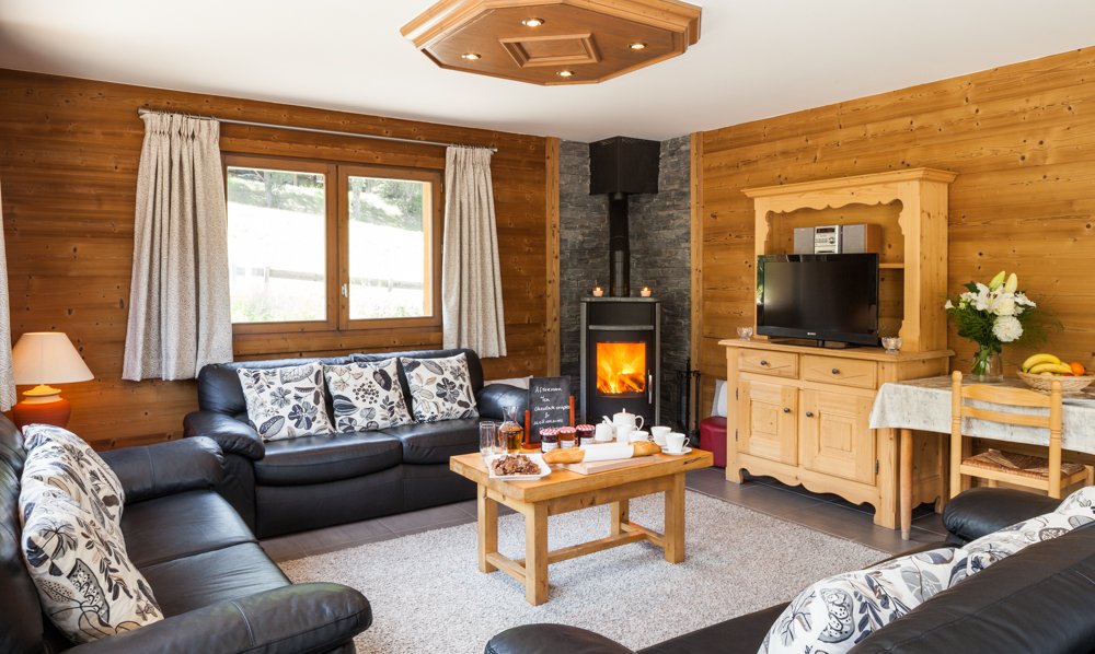 The Living room with stove in Chalet Covie in Meribel Les Allues