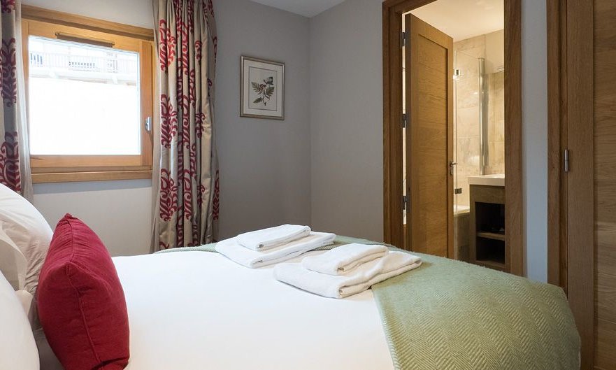A double bedroom with ensuite bathroom in Chalet Montana in Meribel Centre