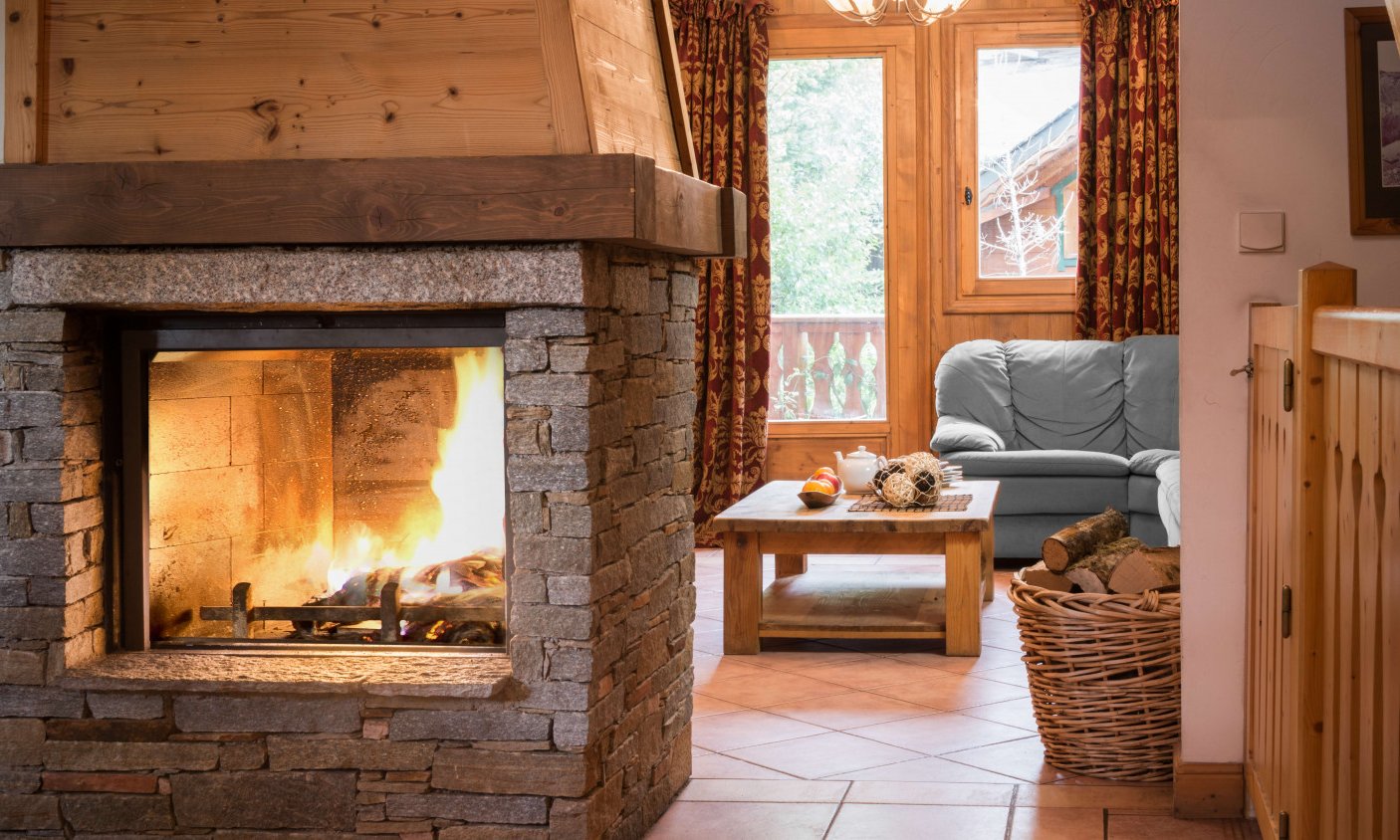 The Fireplace and Living area in Chalet Topaz in La Tania