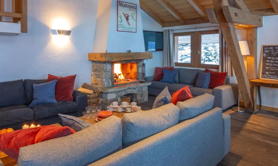 The living area with fireplace in Chalet Rikiki Courchevel Moriond