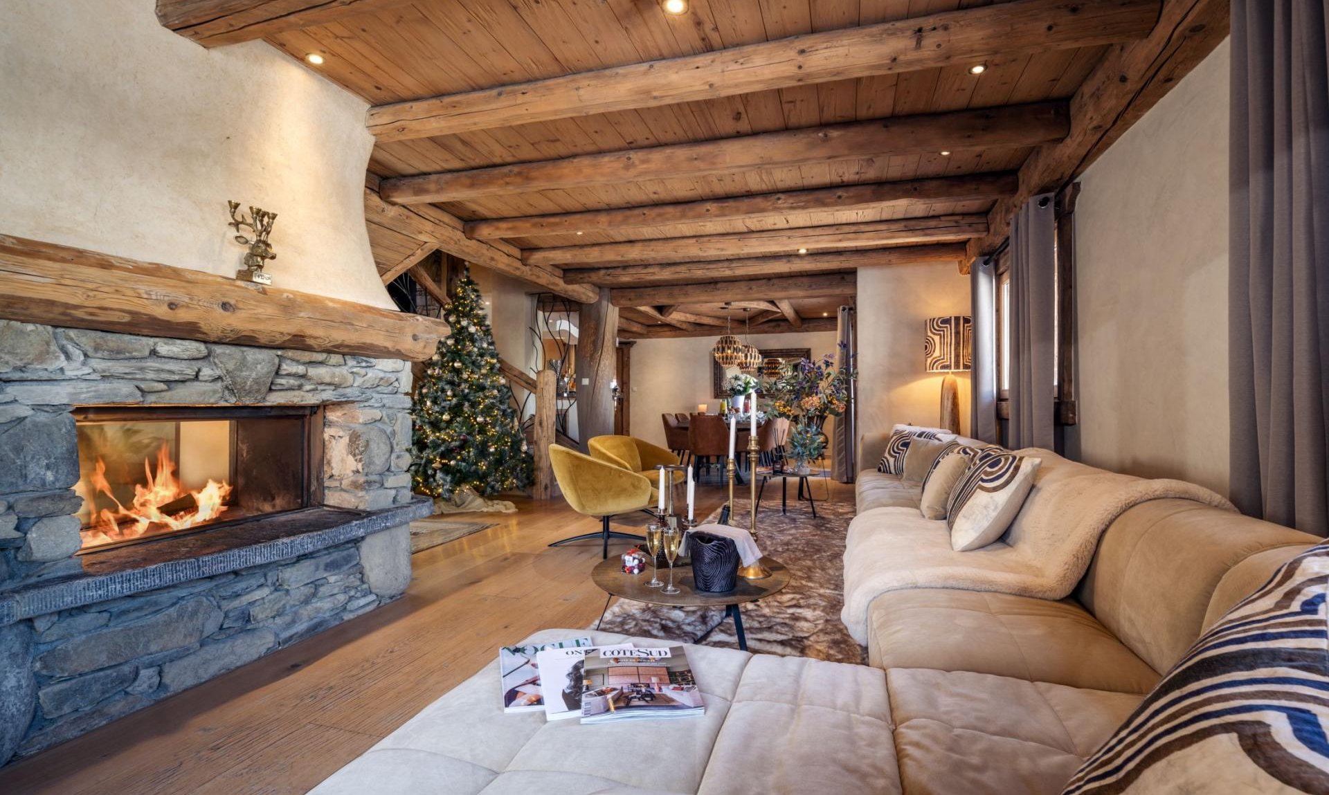 The comfortable Living area with fireplace in Chalet Cheval Blanc Meribel Le Raffort
