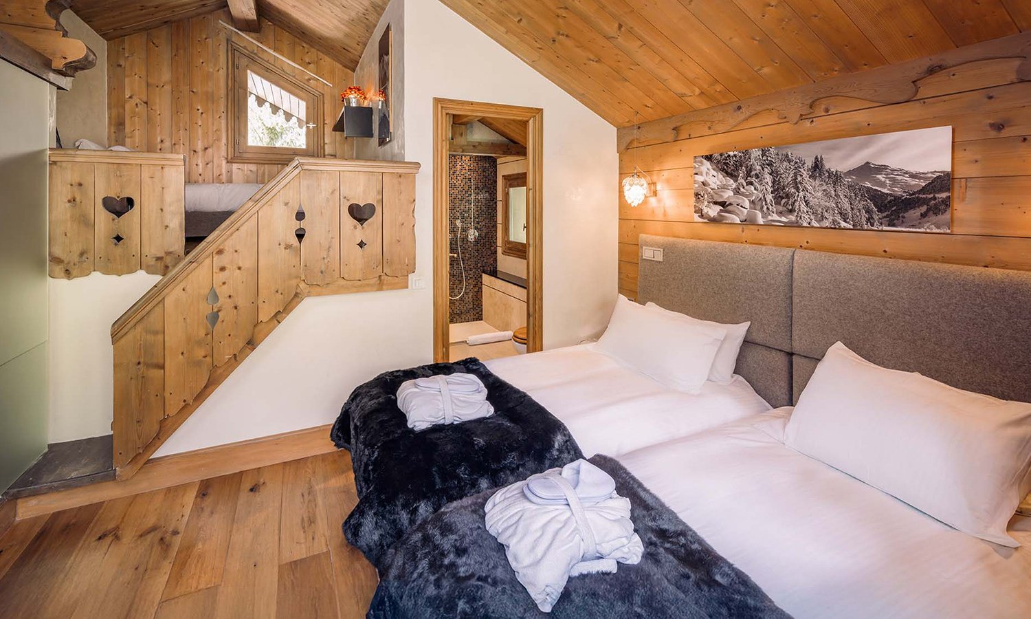 The bedroom with mezzanine area in Chalet Mariefleur in Meribel