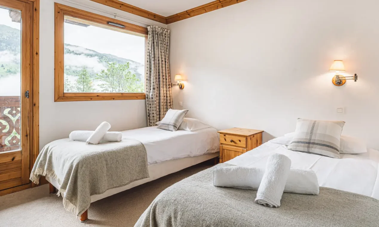 A twin bedroom in Chalet Virage in Meribel Centre