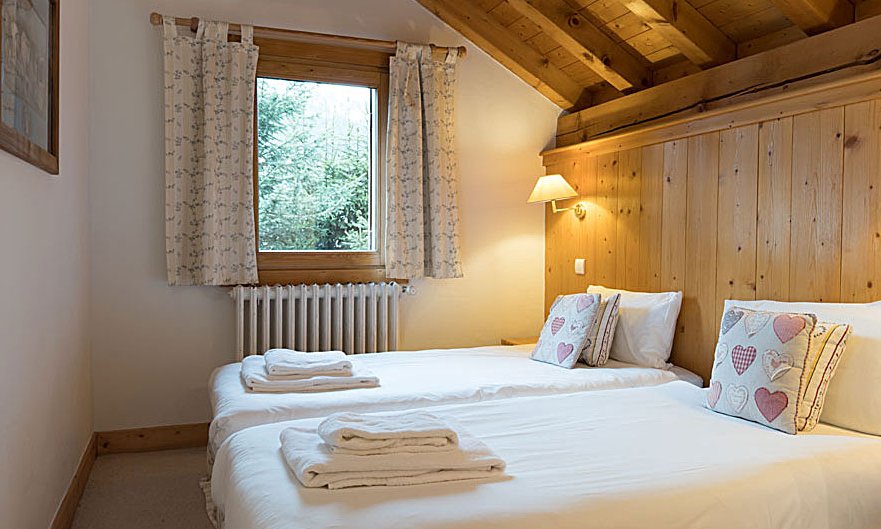 A bedroom in Chalet Blanche Neige in Meribel Centre