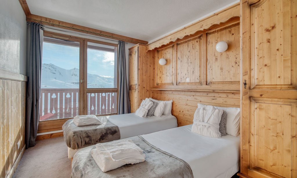 One of the Twin bedrooms in Catered Chalet Bonhomme Val Thorens