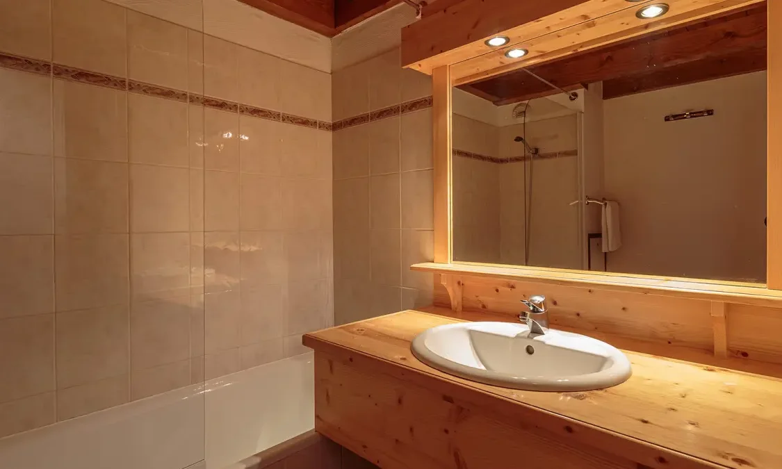 A bathroom in Catered Chalet Pierre Meribel Mottaret