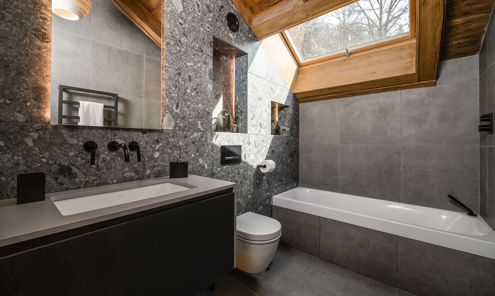 A bathroom in Chalet Infusion Meribel Village