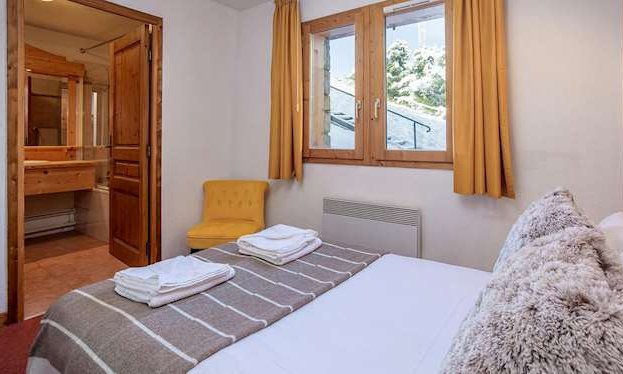 A double bedroom in Chalet Nico Meribel Mottaret