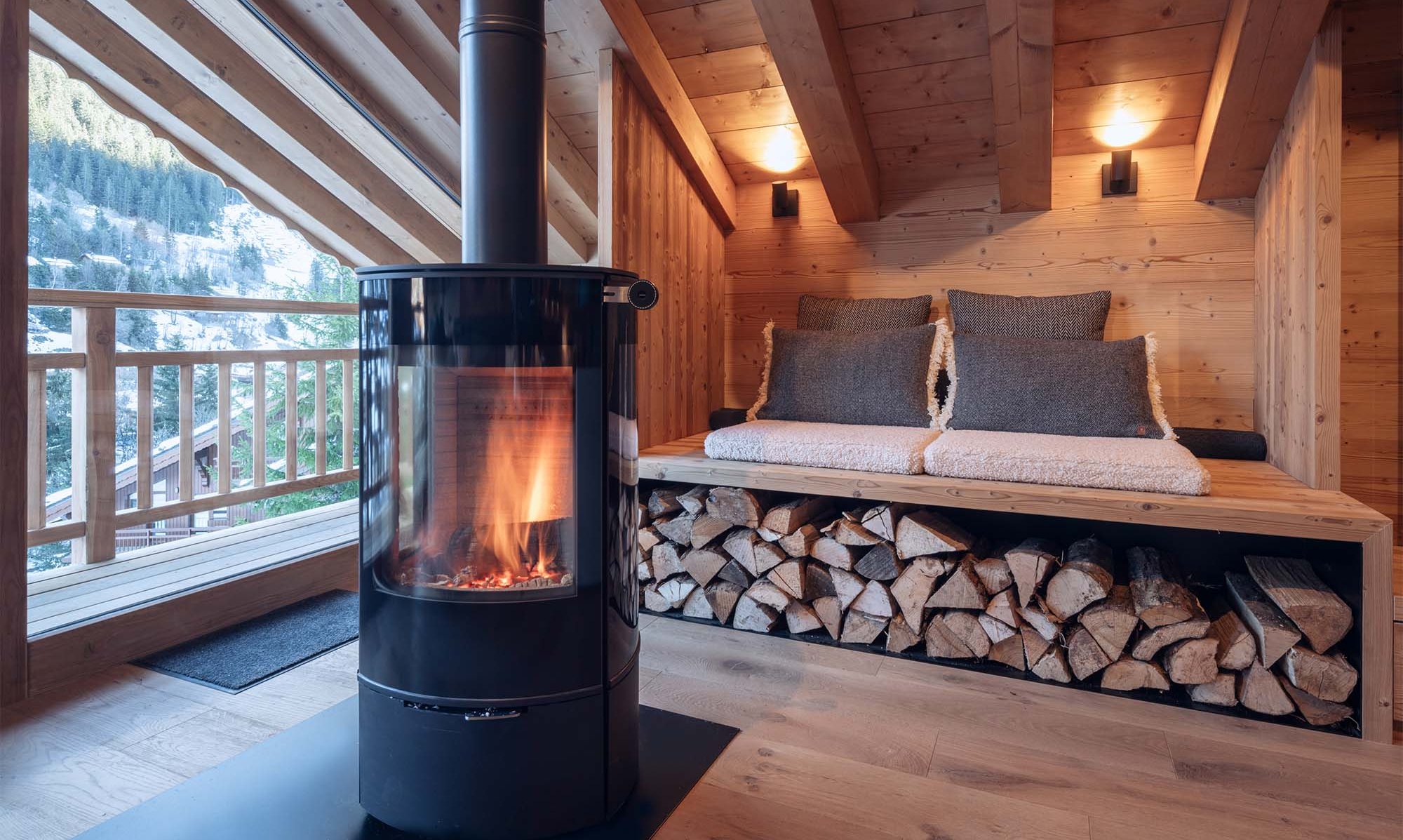 The Stove in the living area Chalet Harmony Meribel