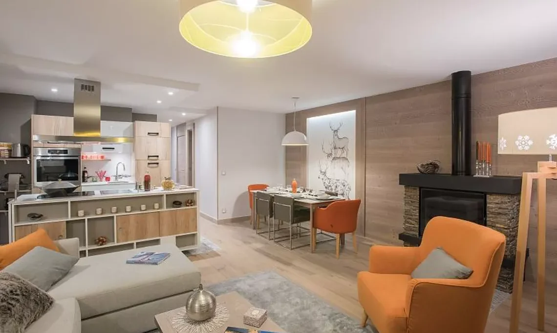 The Living, dining and kitchen areain a 2 bedroom aparment in Residence L'Hevana Meribel