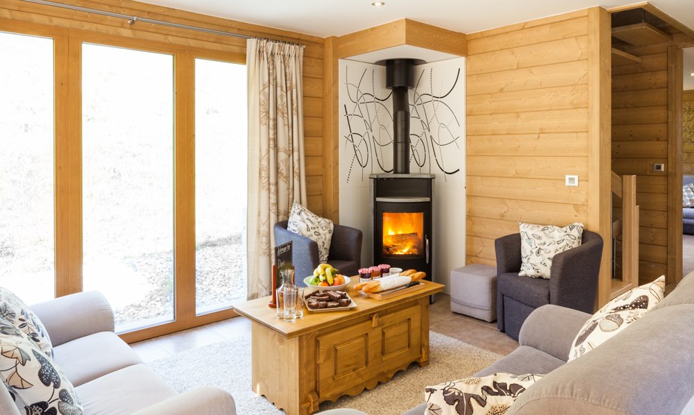 The living area with stove in Chalet Les Sauges Meribel Les Allues