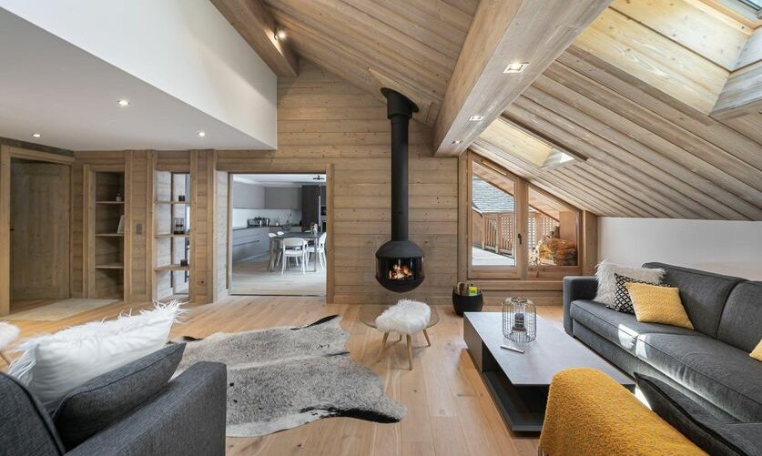 The comfortable Living room with a fireplace in Apartment Le Glaciers 12 Meribel