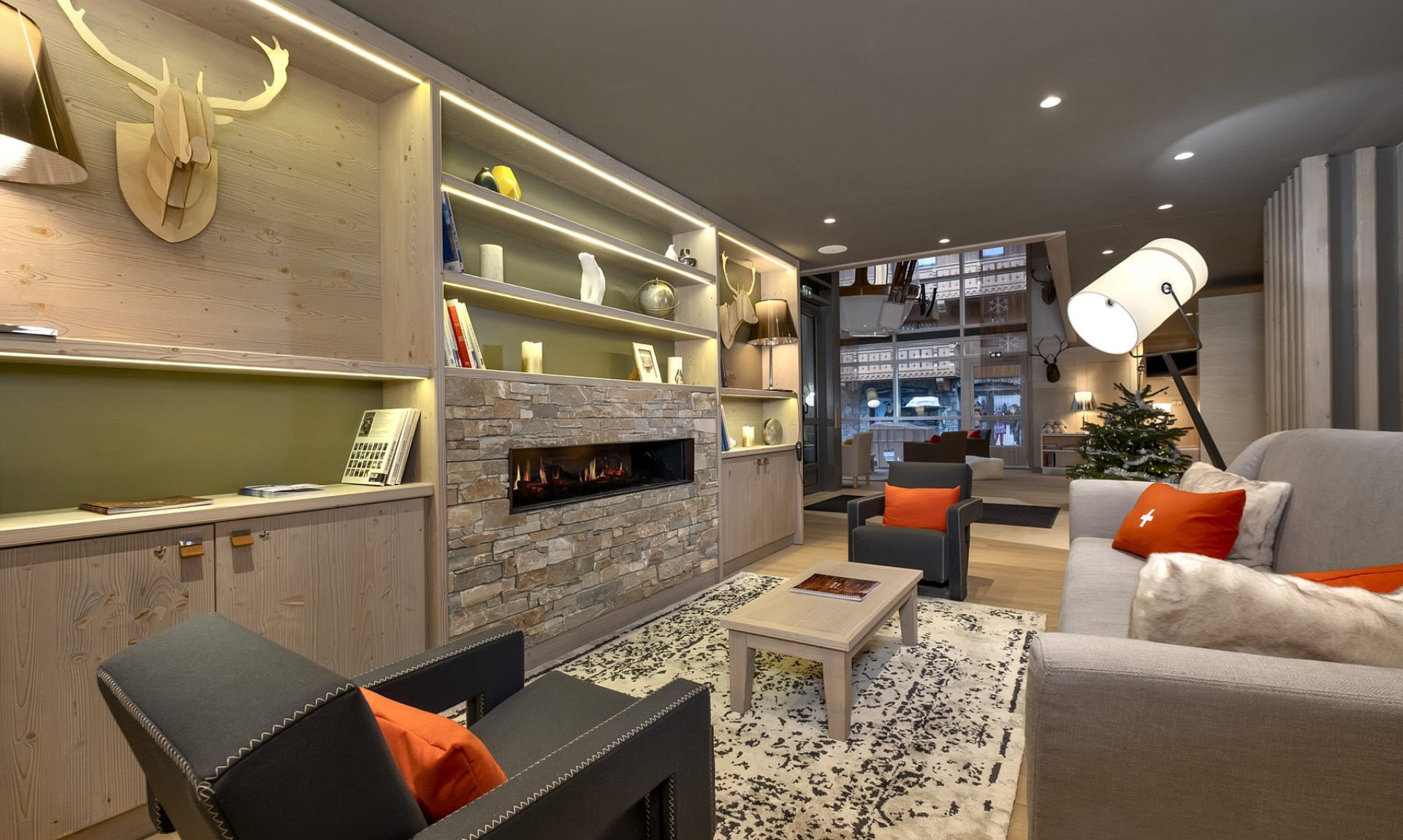 The Lounge area with a fireplace in one of the Apartments in Residence L'Hevana Meribel