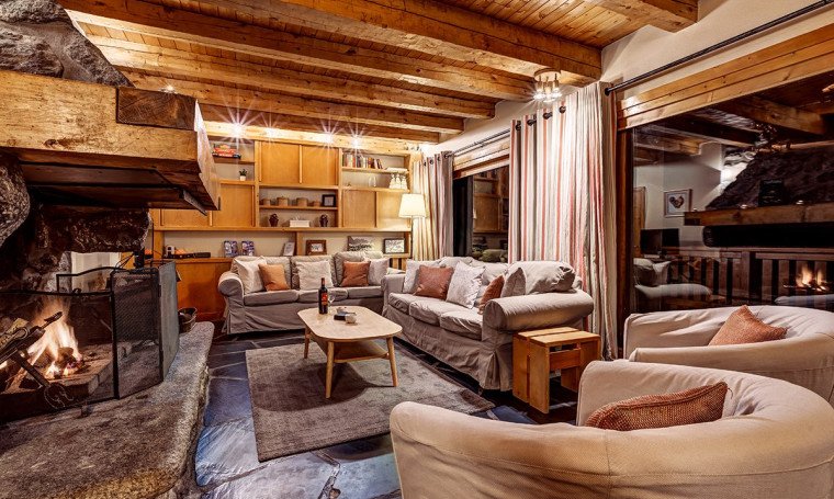 The living room and fireplace in Chalet Cecilia Meribel