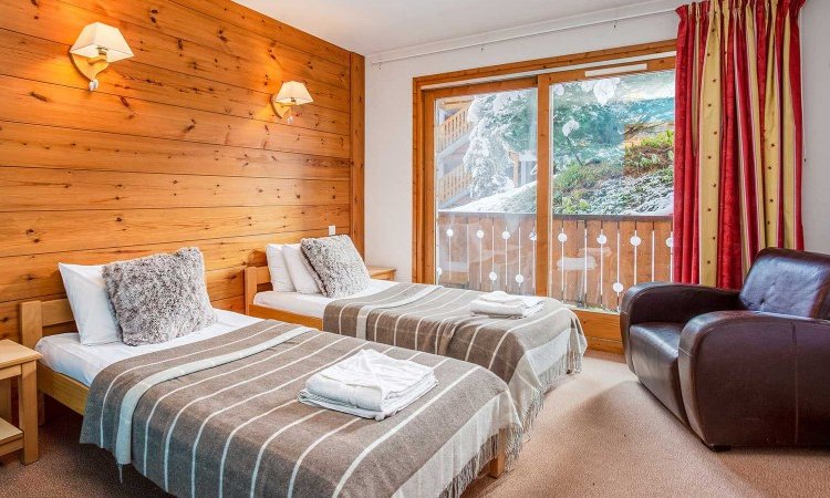 A Twin bedroom in Chalet Natalette II Meribel Mottaret