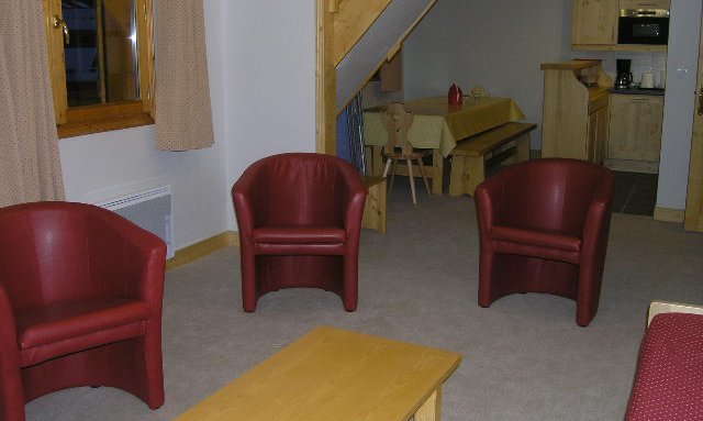 The living, dining and kitchen area in apartment Aubepine