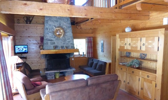 Comfortable living room with fireplace in Chalet La Renarde