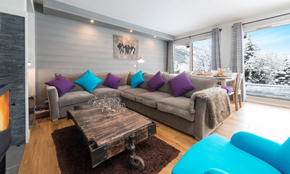 Lovely Living area with fireplace in Chalet Le Christope in Meribel Village