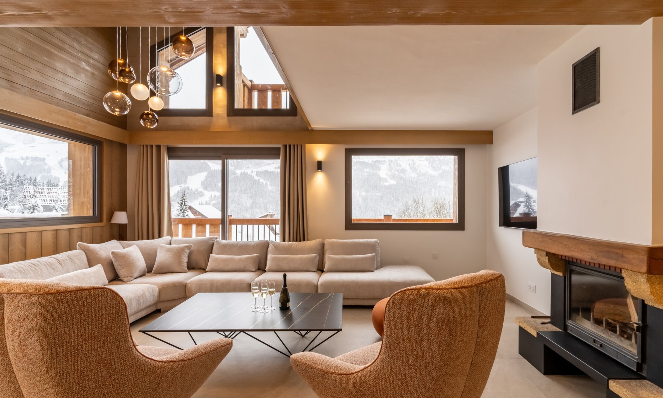 The Living area with fireplace in Chalet Evergreen Meribel