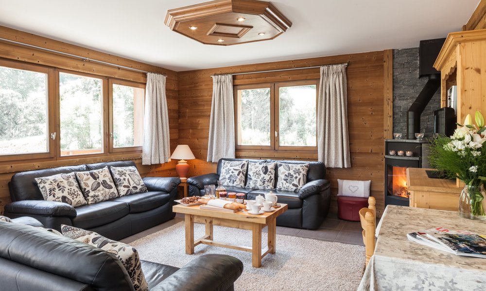 Living room and fireplace in Chalet Charmille, Meribel