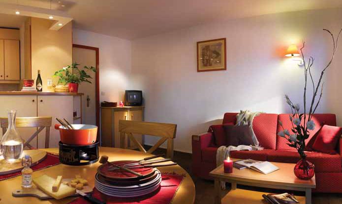 The living and dining area in the Ravines apartments Meribel