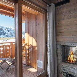 The Fireplace and Balcony in Apartment Parc Alpin 302 Meribel