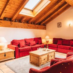 The Living area with a fireplace in Chalet Azalee Meribel