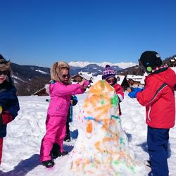 Children making a snowman