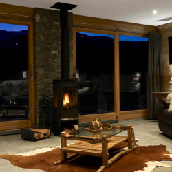 Living room with Stove in Chalet Chamois in Meribel