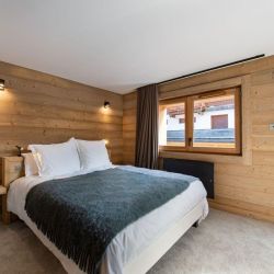 A comfortable bedroom in Apartment Le Glaciers 12 Meribel