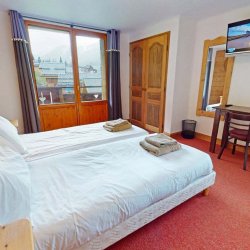 One of the comfortable bedrooms in Chalet Daurel, Meribel Centre