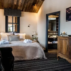 A luxury bedroom in Chalet Tomkins in Meribel