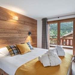 A double bedroom in Chalet Etoile des Neiges Meribel
