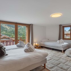 One of the bedrooms in Chalet Etoile des Neiges Meribel