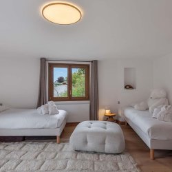 One of the bedrooms in Chalet Etoile des Neiges Meribel